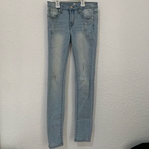 Slightly ripped girls skinny jeans